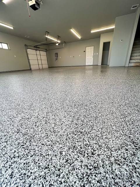 Gray and black flake epoxy garage floor in a residential home